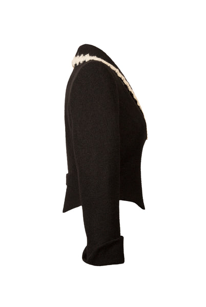 Side View of Atelier Francesca Black Jacket shows hem detail.