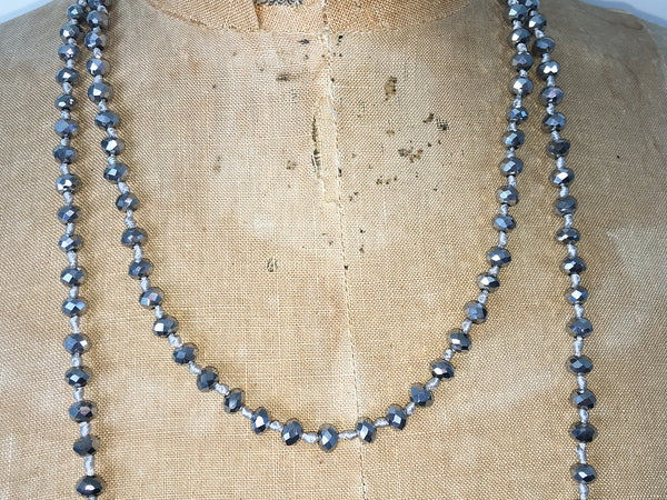 Close up of Lil Jewellry, faceted crystal necklace in silver