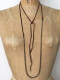 Alicia Van Fleteren necklace has dark pyrite attached to brown leather ties.
