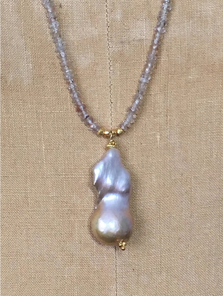 Close up of Alicia Van Fleteren necklace with a champagne pearl, champagne quartz, zircon and gold vermeil findings