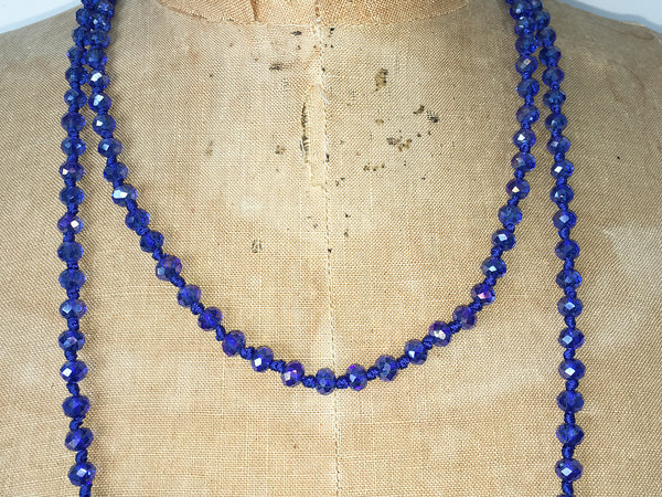 Close up of Lil Jewellry, faceted crystal necklace in blue