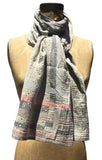 The Letol Daphne scarf has soft geometric and snowflake motifs in warm grey, greys with soft coral.