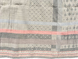 Detail of the Letol scarf, Daphne in warm grey, greys with soft coral.