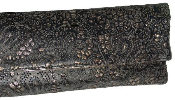 Detail of Louise Farnay laser cut leather clutch in black & bronze