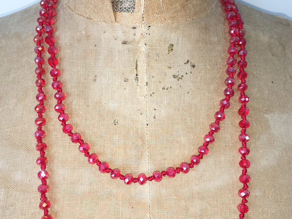 Close up of Lil Jewellry, faceted crystal necklace in red